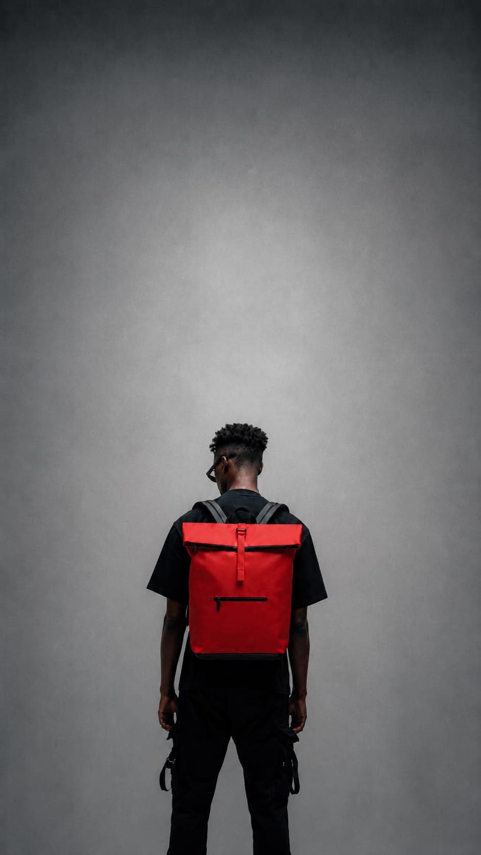 Model wearing NORJ red backpack
